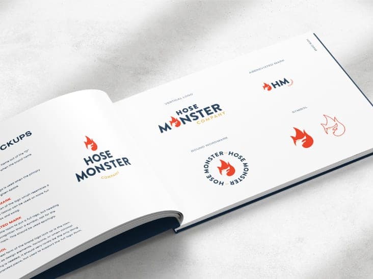 A close up of an open copy of the Hose Monster brand book.