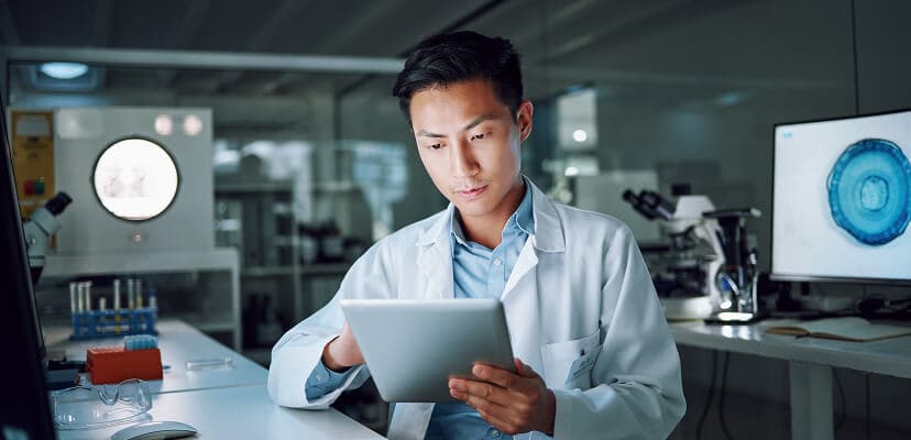 A doctor working on a tablet